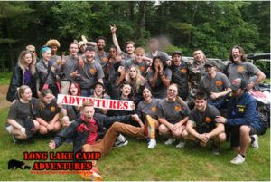 Long Lake Camp Adventures staff group celebrating outdoors during summer camp activities